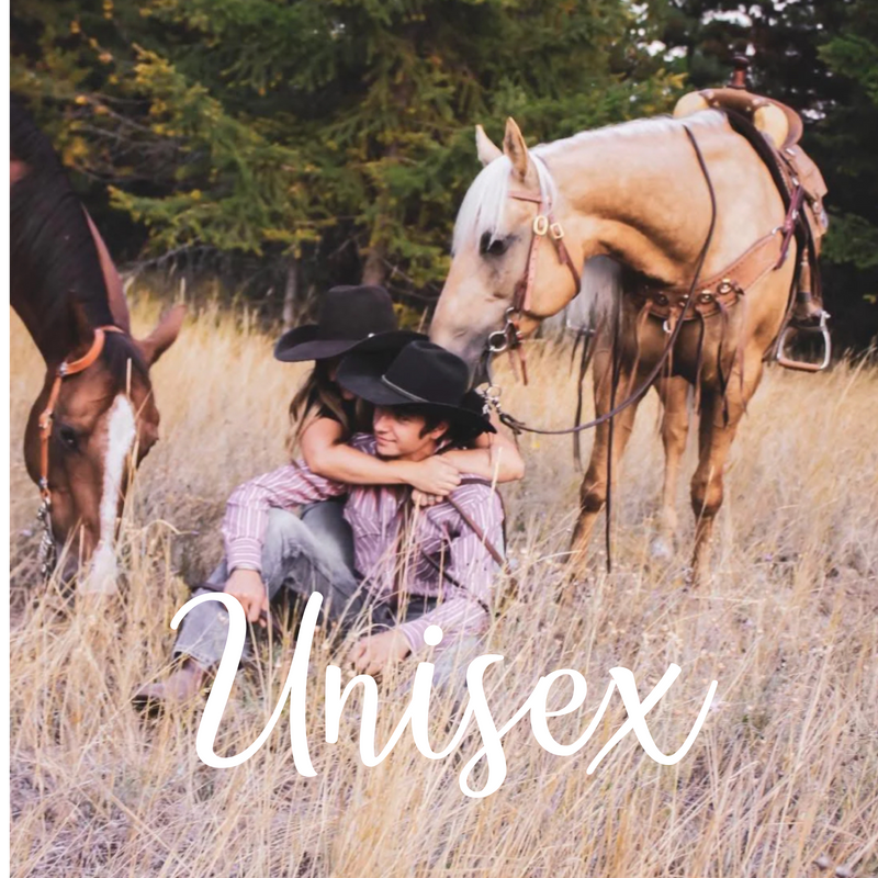 couple with their horses wearing some of rust & redemptions unisex tee shirts faith and western based clothing brand